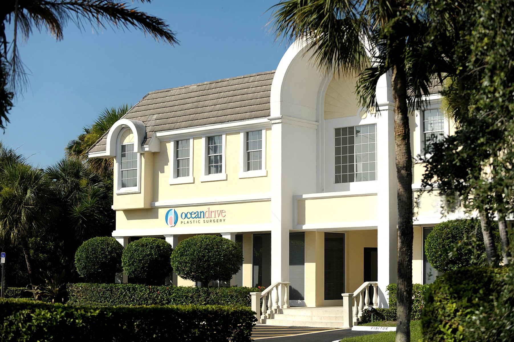 Ocean Drive Plastic Surgery building exterior with palm trees