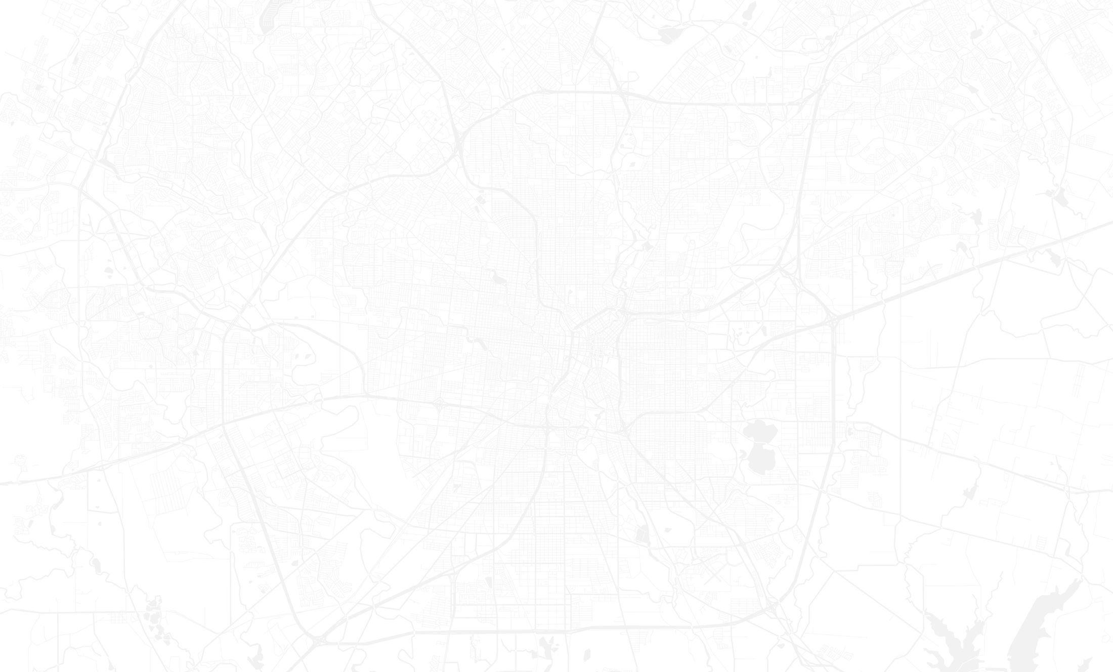 Woman in athletic wear outdoors, looking confidently.