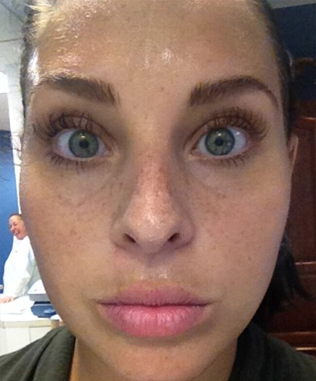 Close-up of a woman with wet skin.