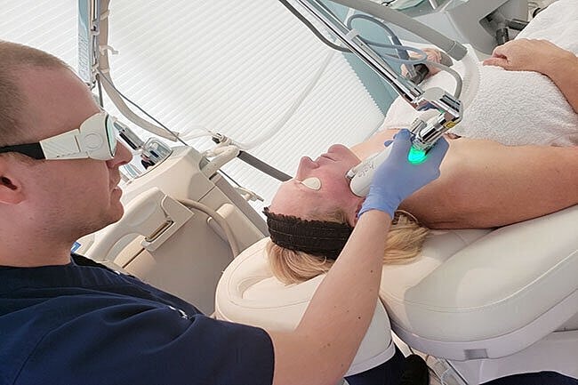 Laser treatment session in a skincare clinic.