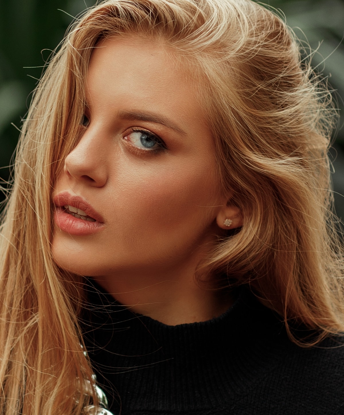 Close-up portrait of a woman with long hair.