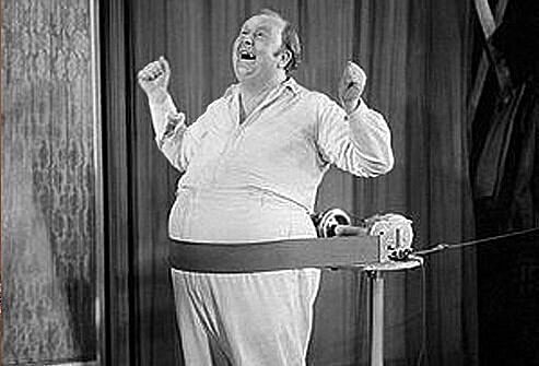 Man using a vintage fitness machine.