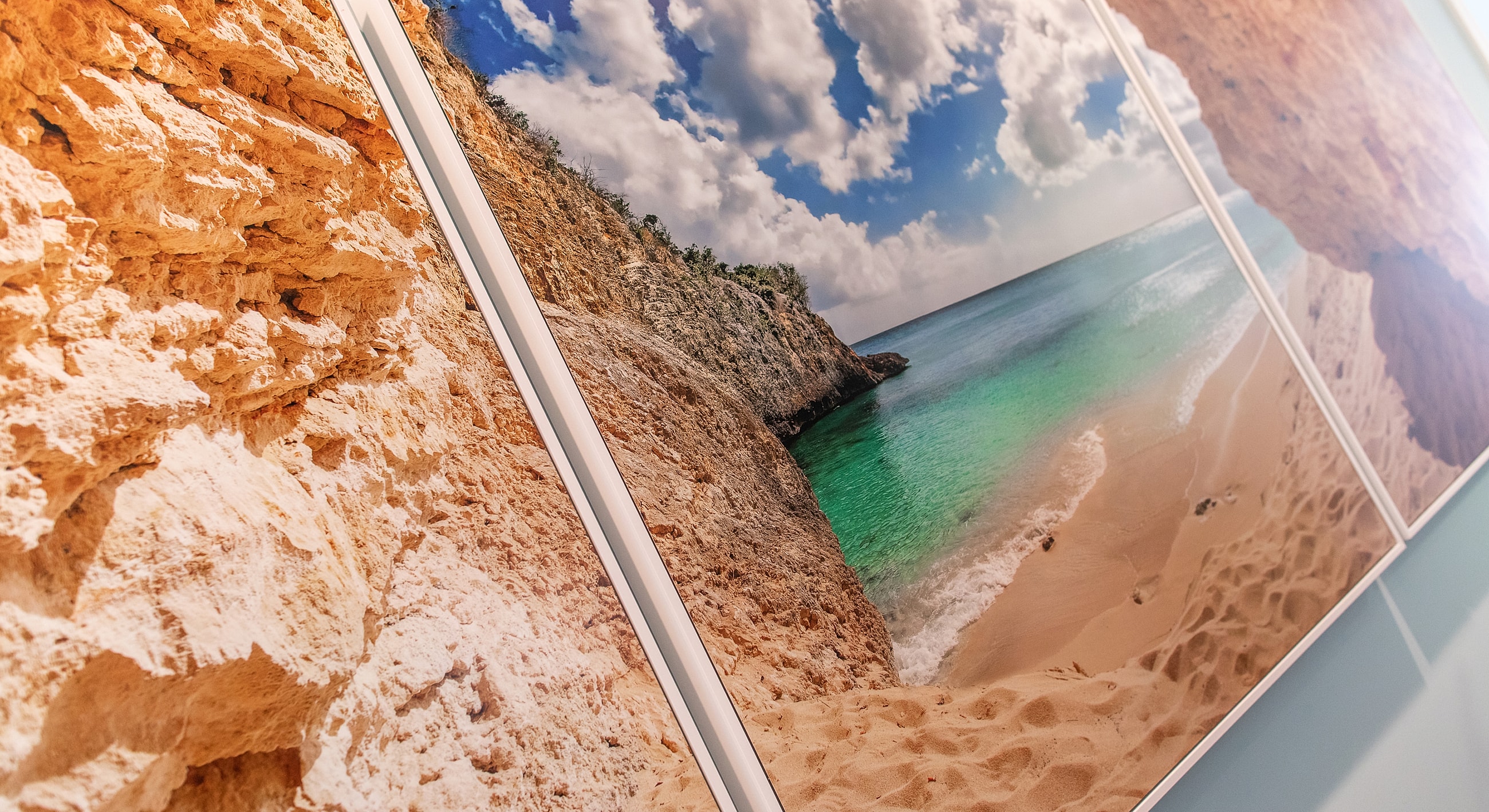 Rocky coastline with turquoise water and clouds.